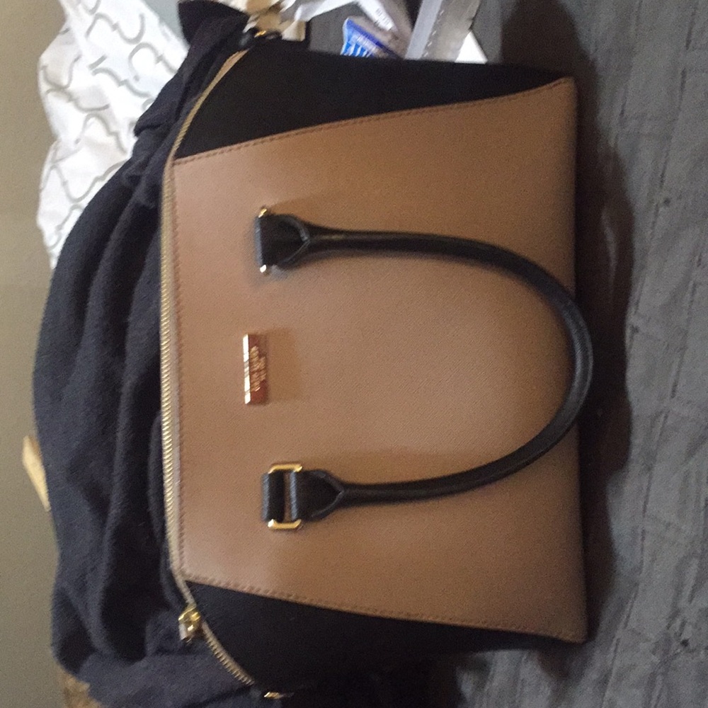 Kate spade black and off-white satchel. Gold trim.